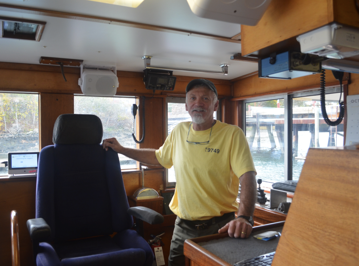 Captain John Thomas in the cockpit of the Rachel Leah